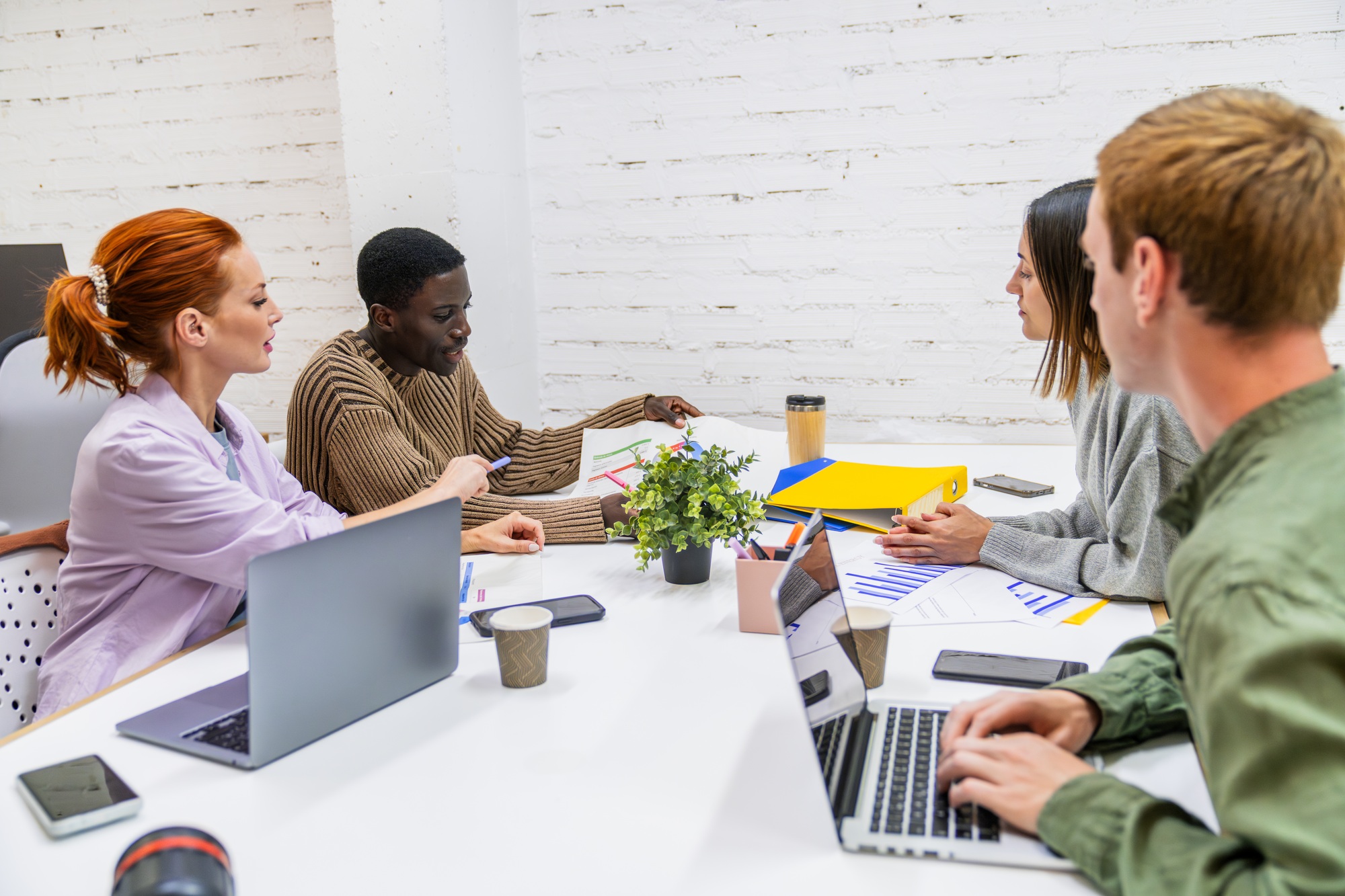 Marketing professionals collaborating on project in coworking space